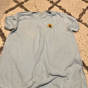 Blue shirt with a sunflower on the left side !